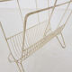 Mid-century white metal magazine stand