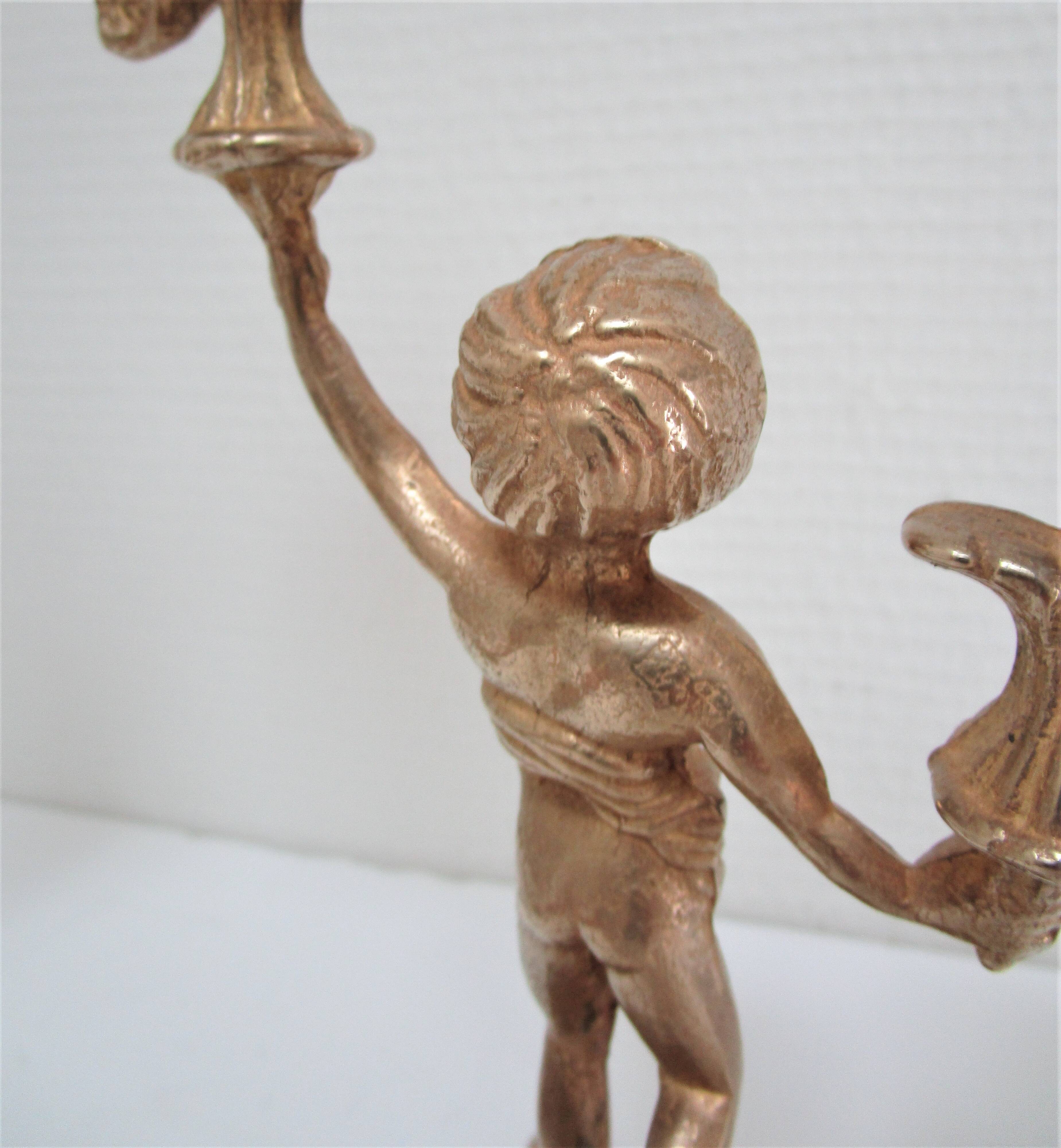 Pair of vintage golden brass cherub candlesticks