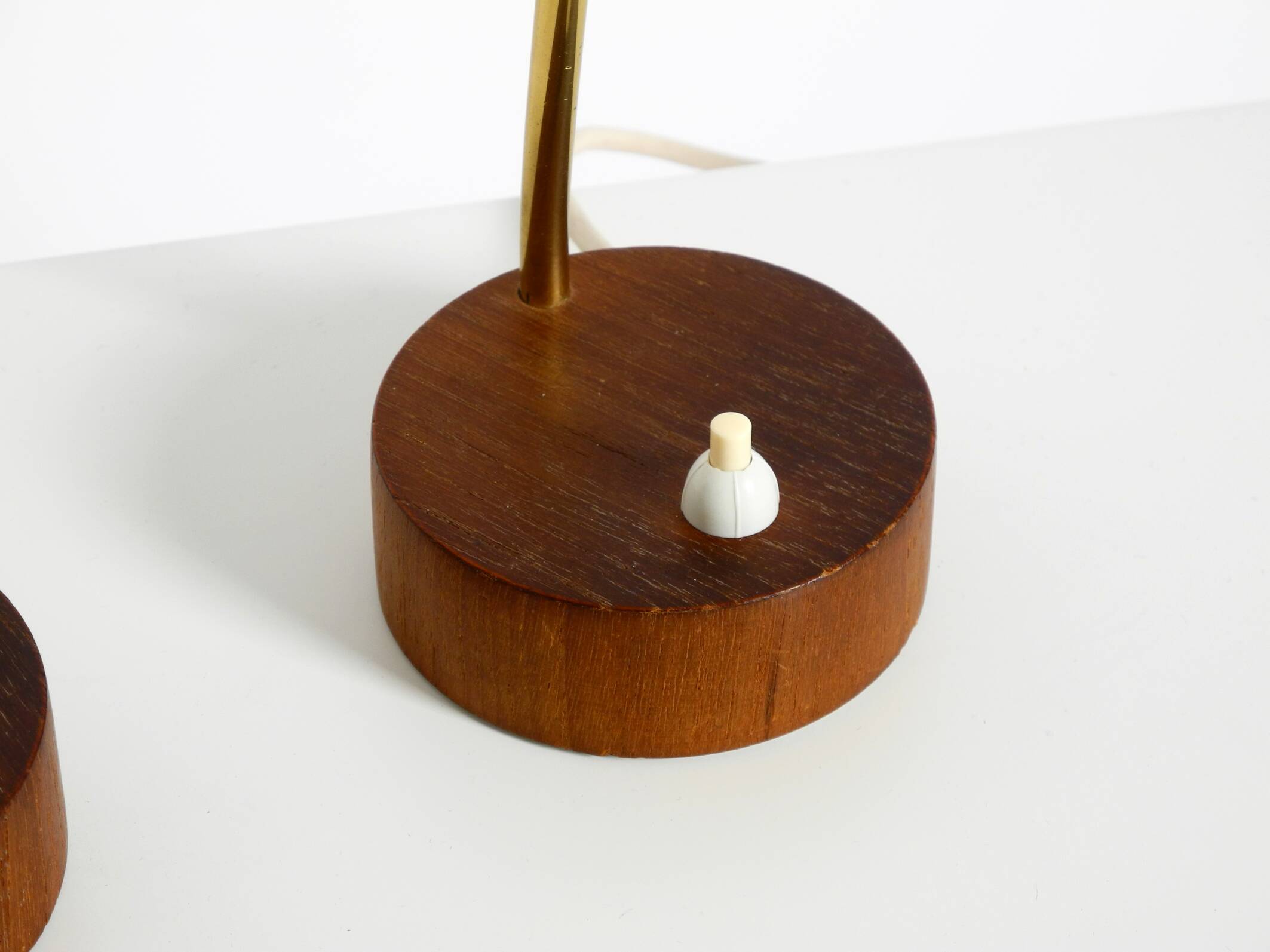 A pair of mid-century modern bedside lamps with perforated metal shades