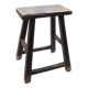 Rectangular stool in raw black elm.