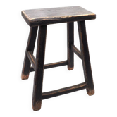 Rectangular stool in raw black elm.