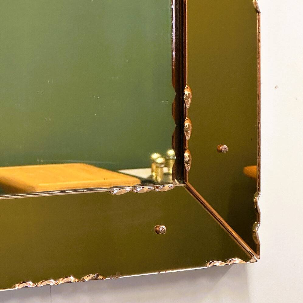 Striking French amber-coloured mirror with sculpted edge details, 1940s