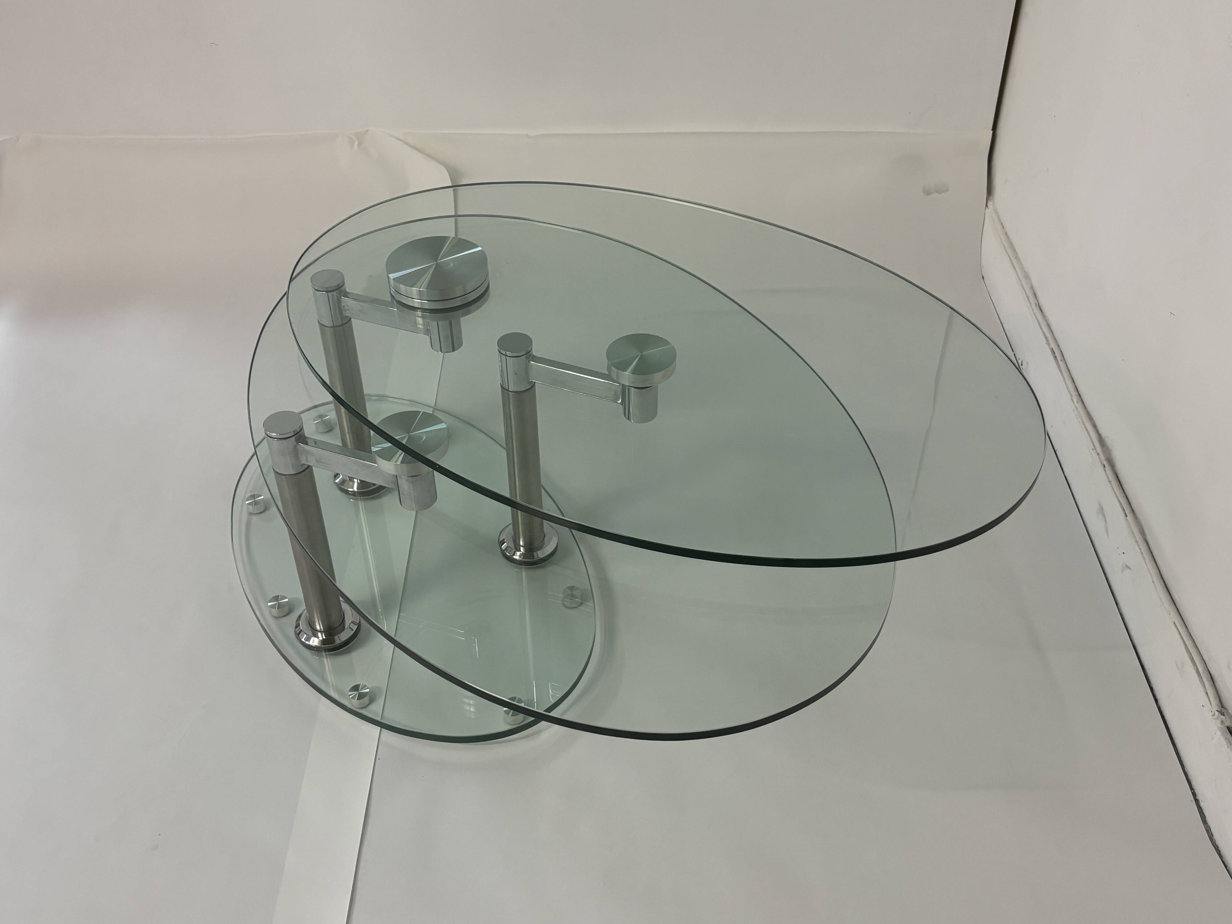 Oval designer coffee table in tempered glass