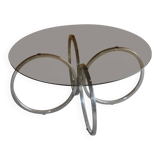 Vintage tubular coffee table in chrome with a transparent glass top, Mid-Century style 1960s.