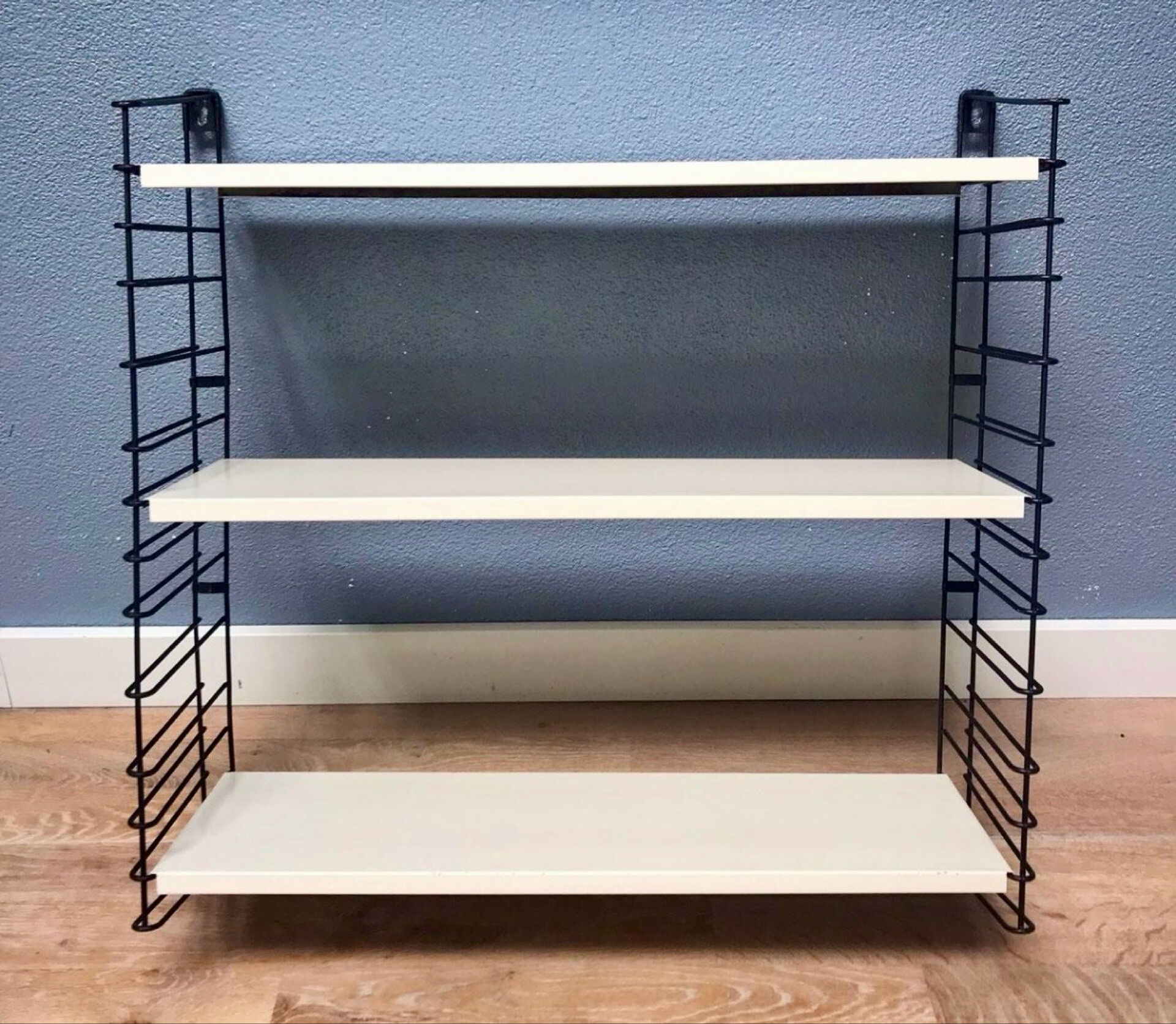 TOMADO — Modular wall shelf, design from 1958