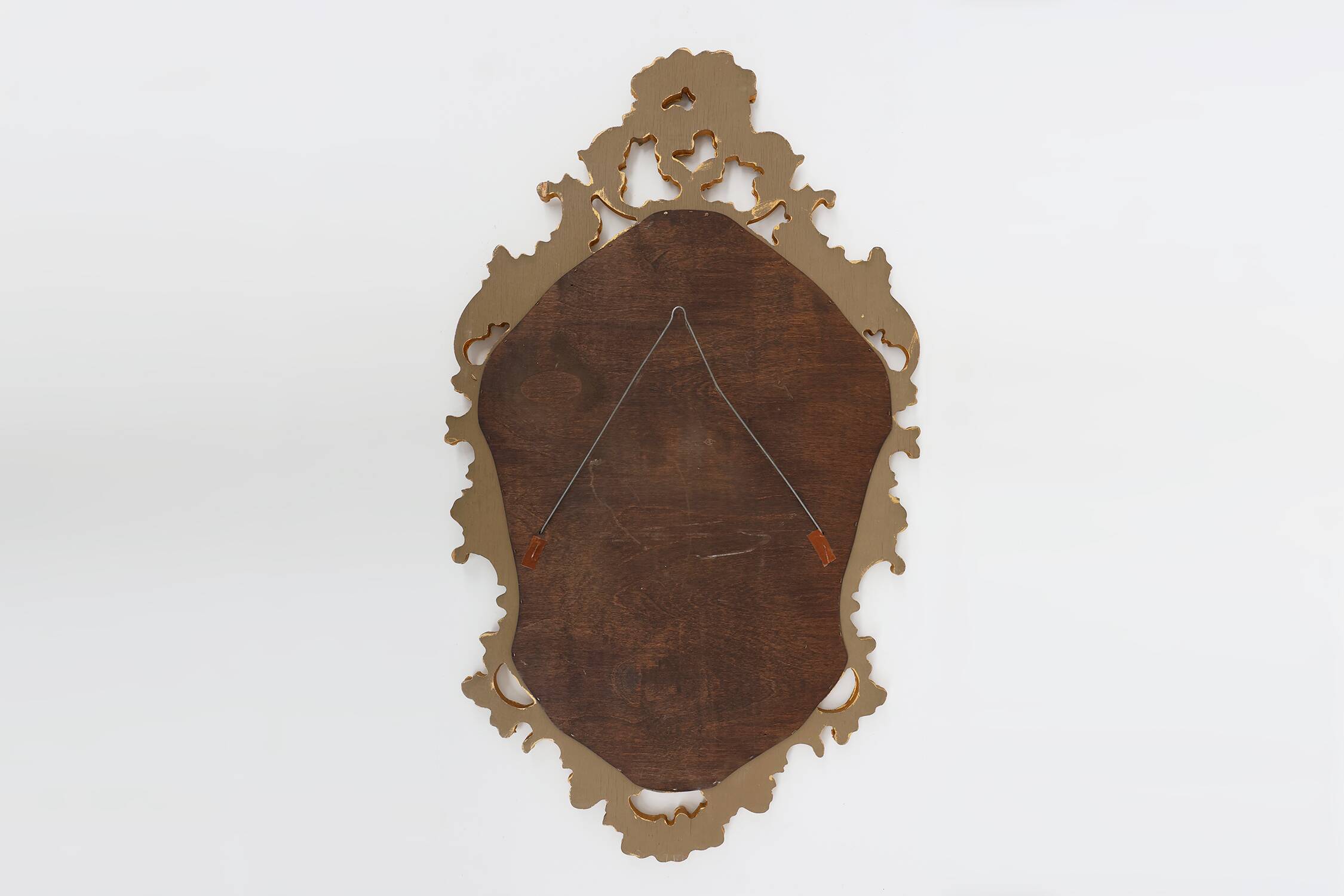 French Rococo or Baroque style facet-cut crest mirror in gilded carved wood