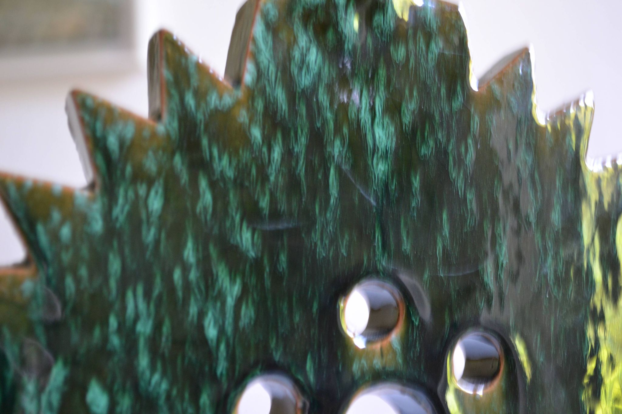 Green ceramic sun candlestick from Tamegroute, Morocco.