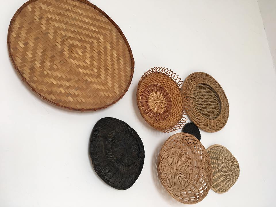 Wall composition of seven baskets and wicker trays