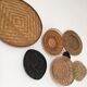 Wall composition of seven baskets and wicker trays