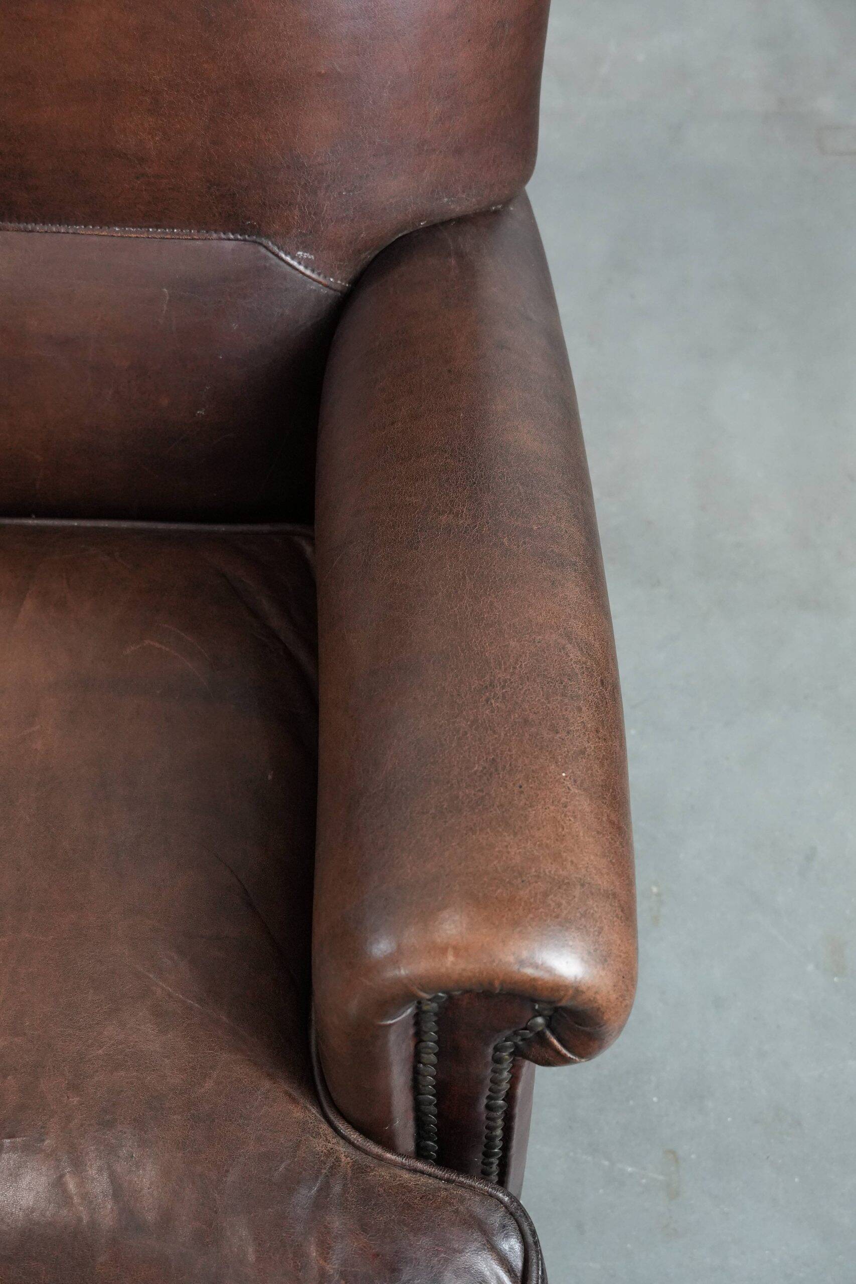 Set of two characterful sheepskin armchairs with a beautiful deep colour