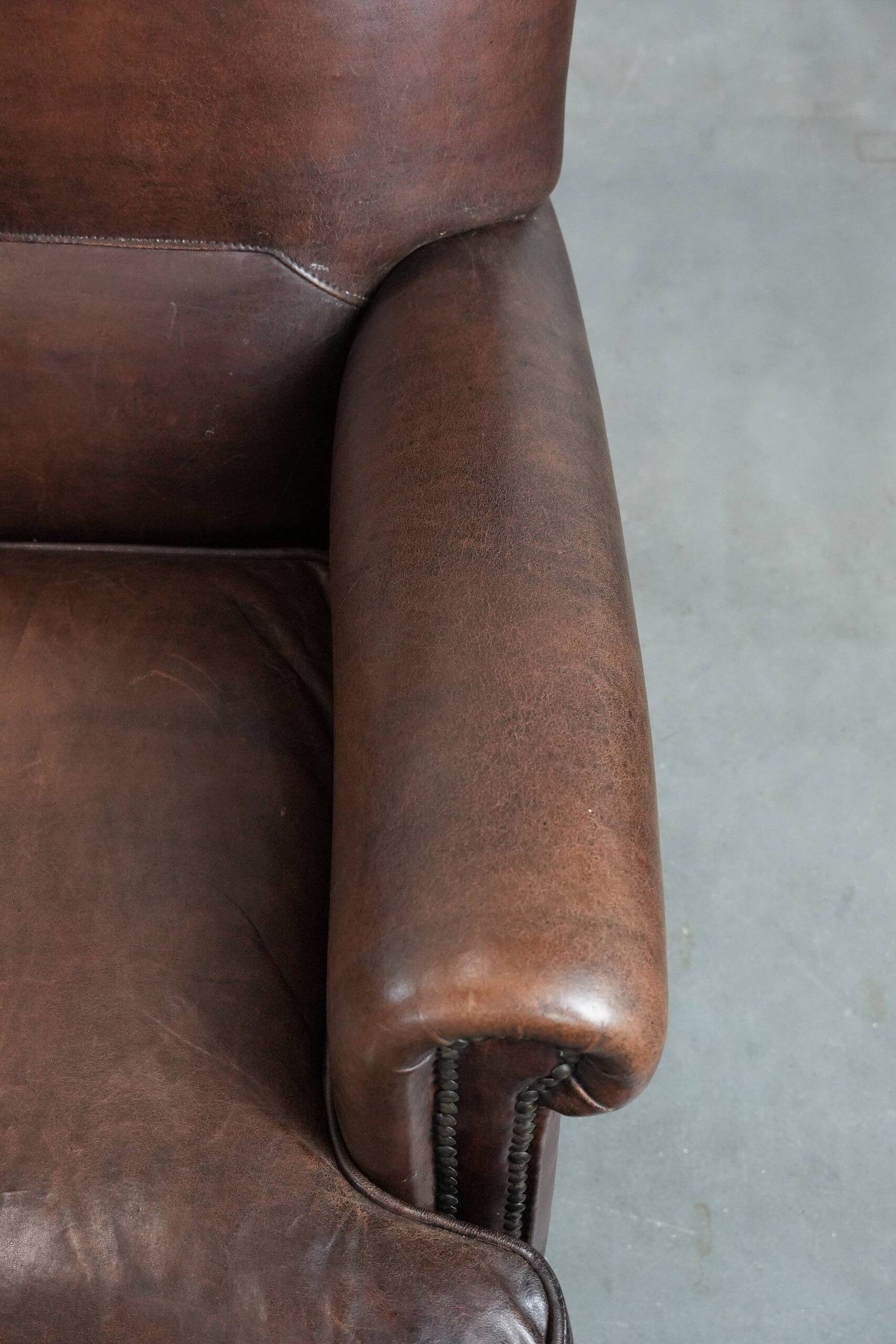 Set of two characterful sheepskin armchairs with a beautiful deep colour