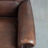 Set of two characterful sheepskin armchairs with a beautiful deep colour