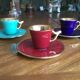 3 cups and mocha saucers in red and green colours