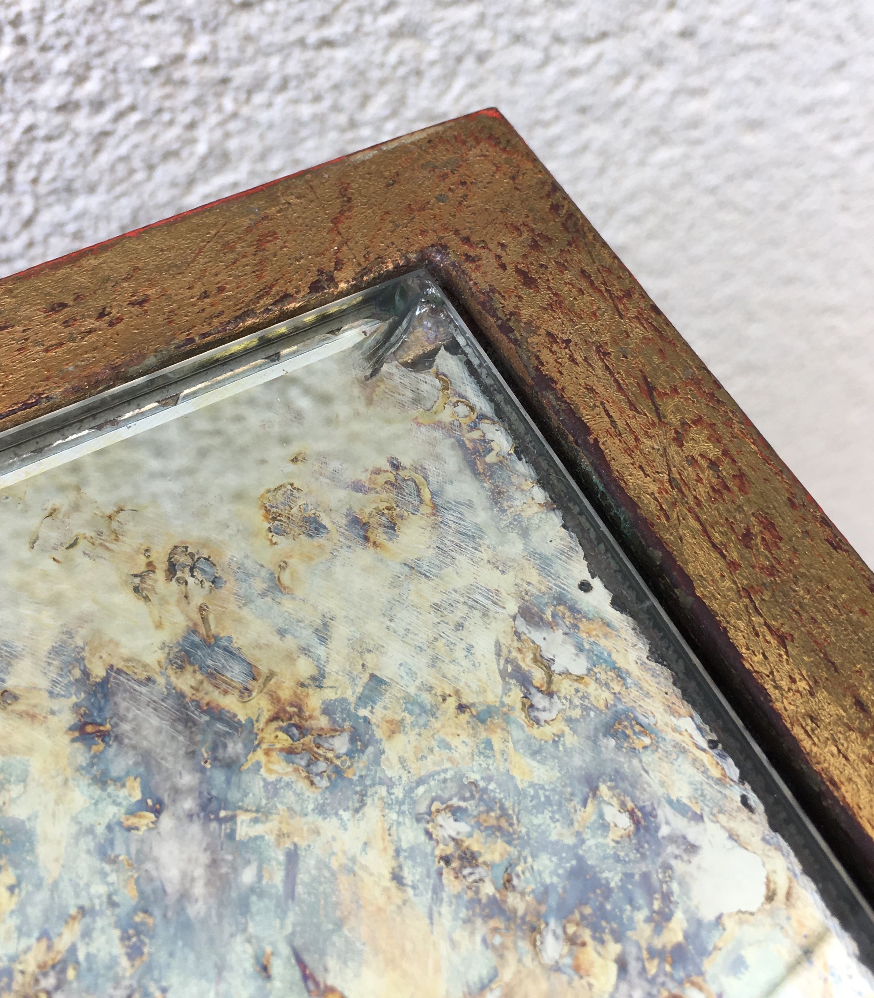 Patinated and gilded steel coffee table in the style of Jacques Quinet.