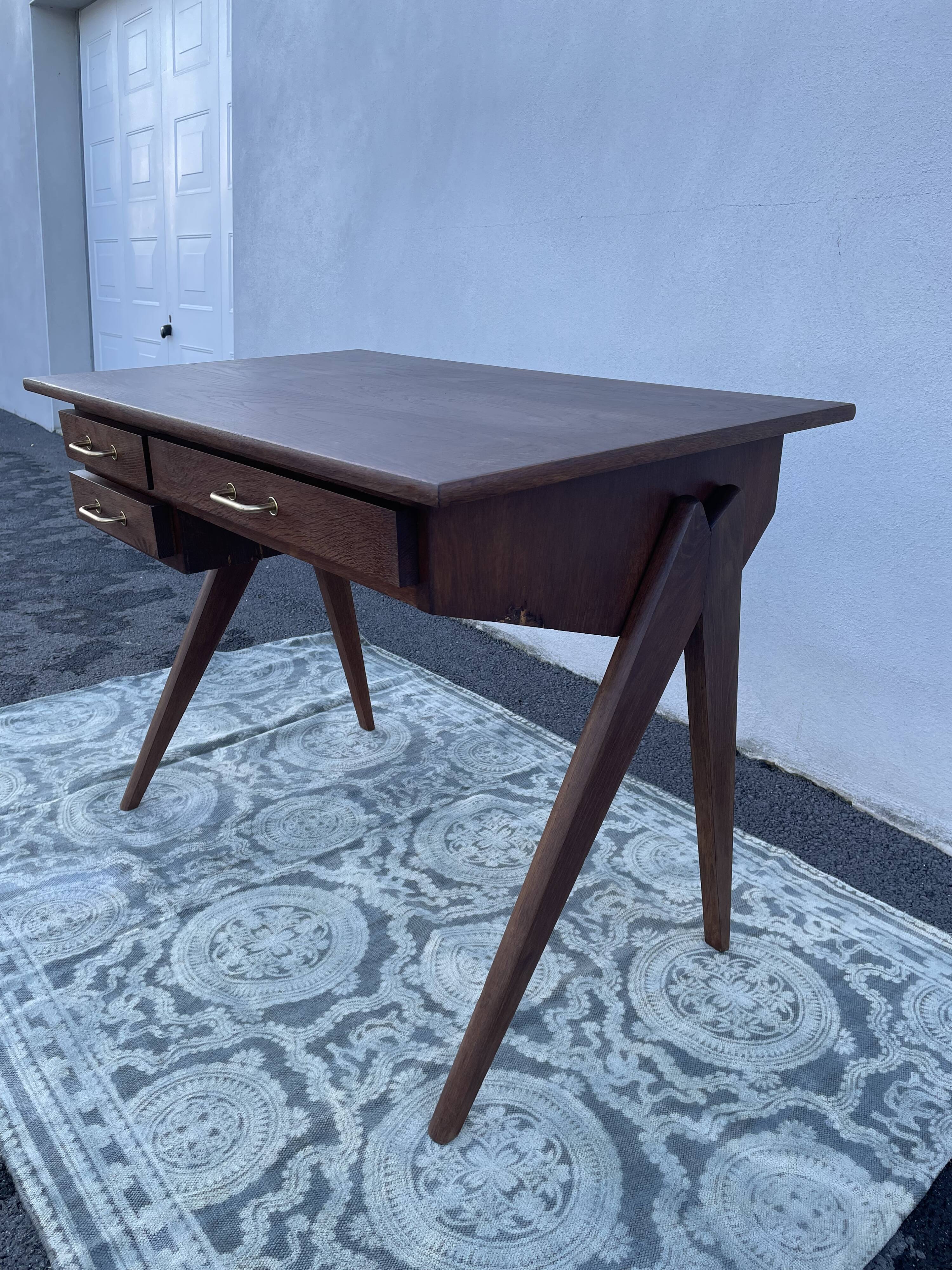 Modernist wooden desk with compass feet 1950