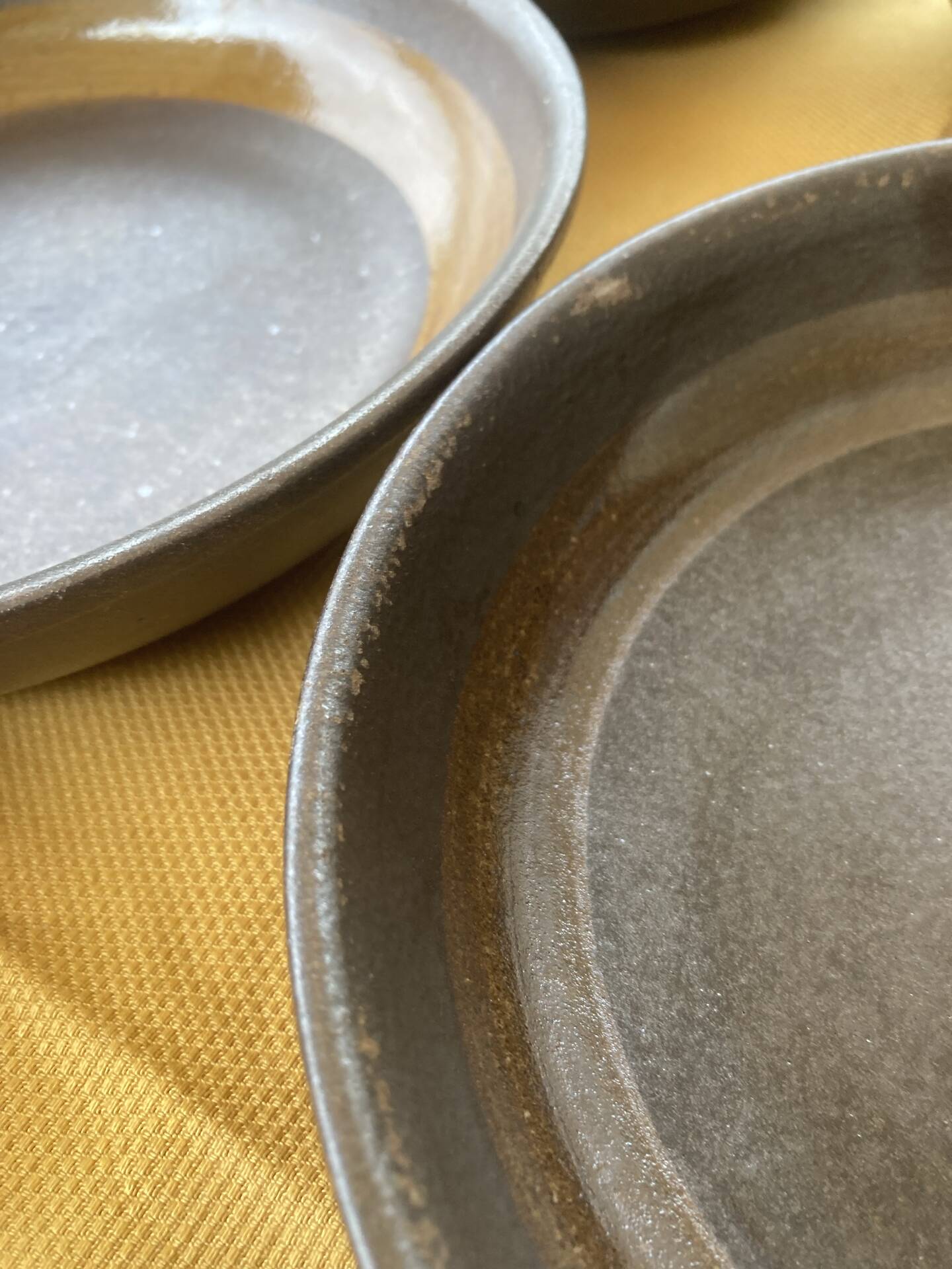 Organic earthenware deep plates from Gré du Marais, France.