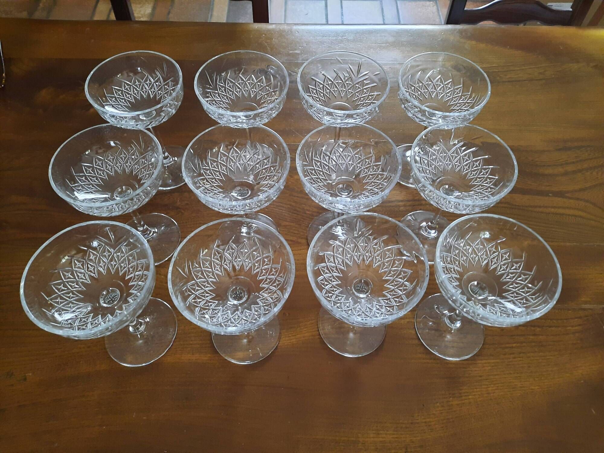 Set of 12 cut glass champagne glasses monogrammed EB.
