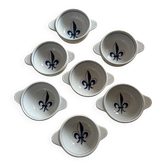 Set of seven earthenware bowls, Quimper, lily flower decoration.