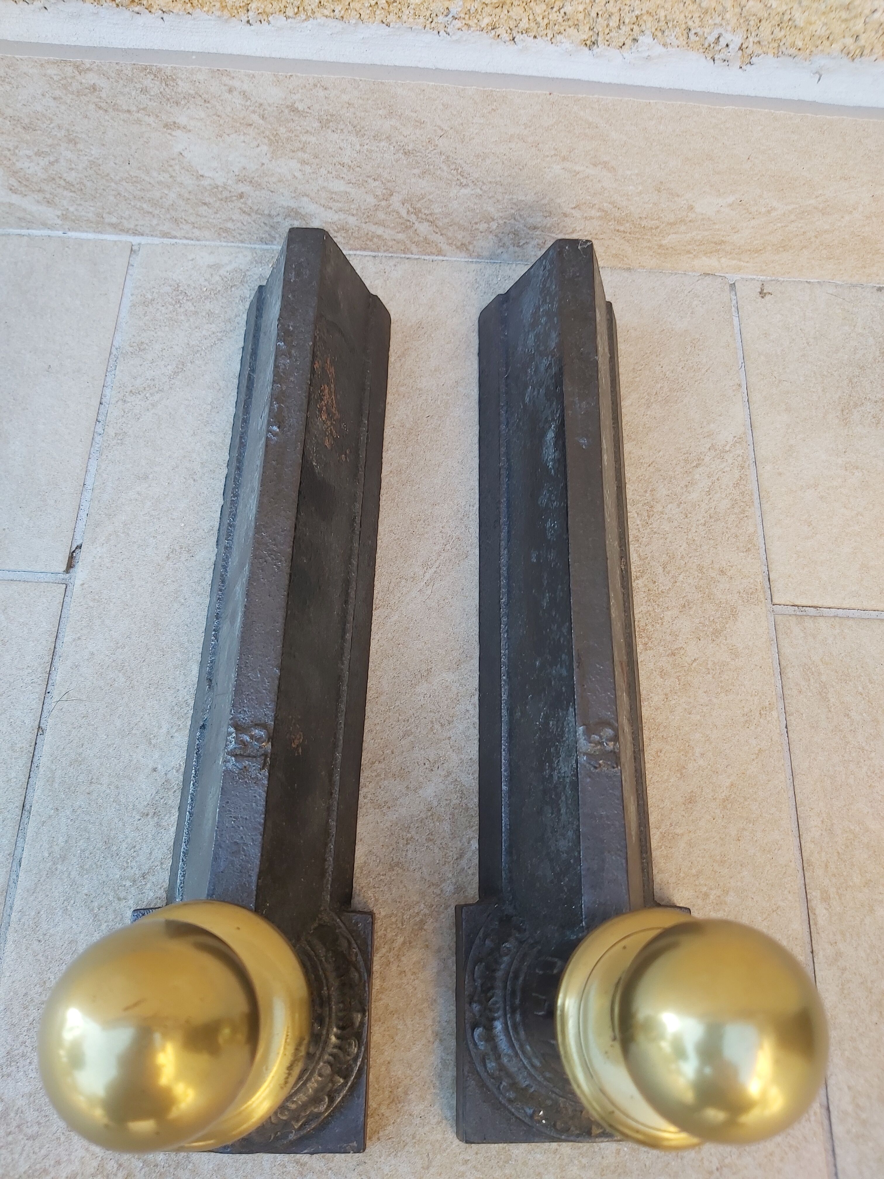 Pair of cast iron and bronze chenets