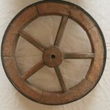 Old wheelbarrow or plow wheel