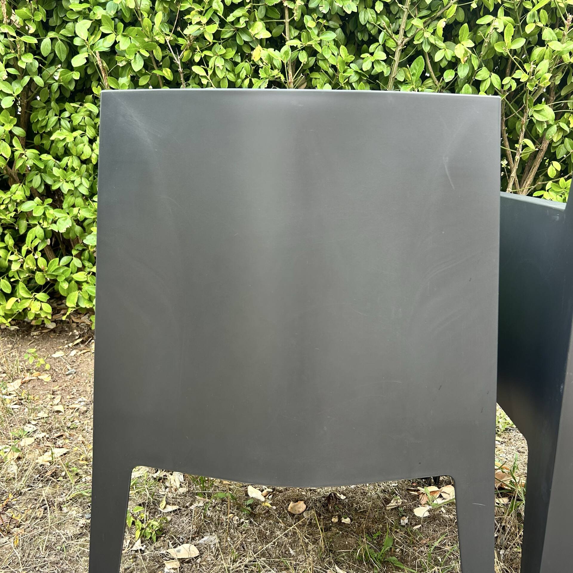 2 black Toy chairs designed by Starck