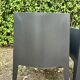 2 black Toy chairs designed by Starck