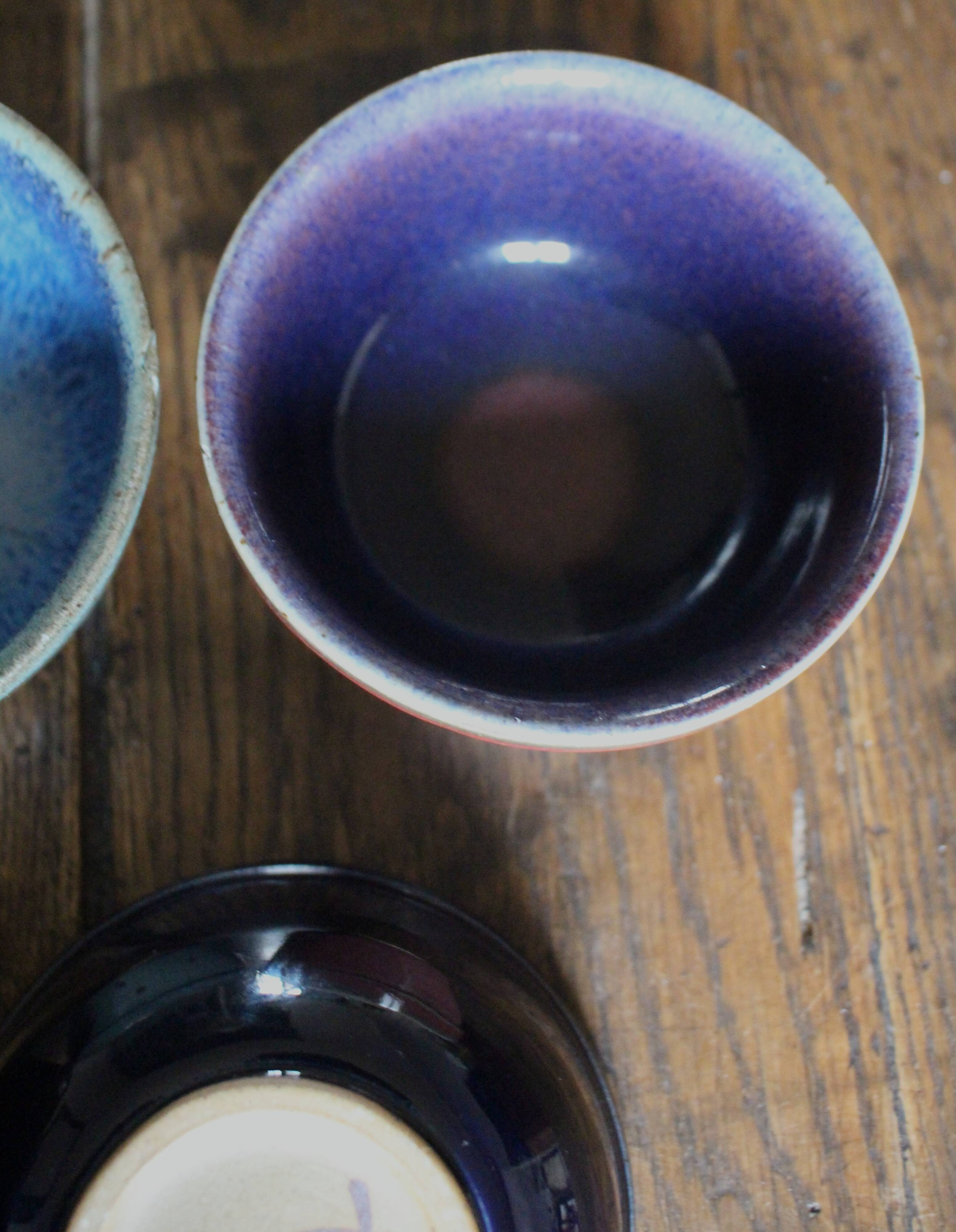 A set of 4 pottery bowls in coloured glaze.