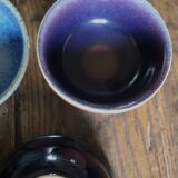 A set of 4 pottery bowls in coloured glaze.