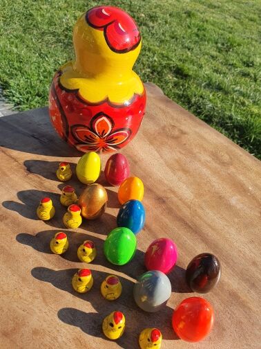 Chicken with eggs and chicks