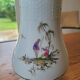 Vase en porcelaine décor polychrome "aux vieux chinois"
