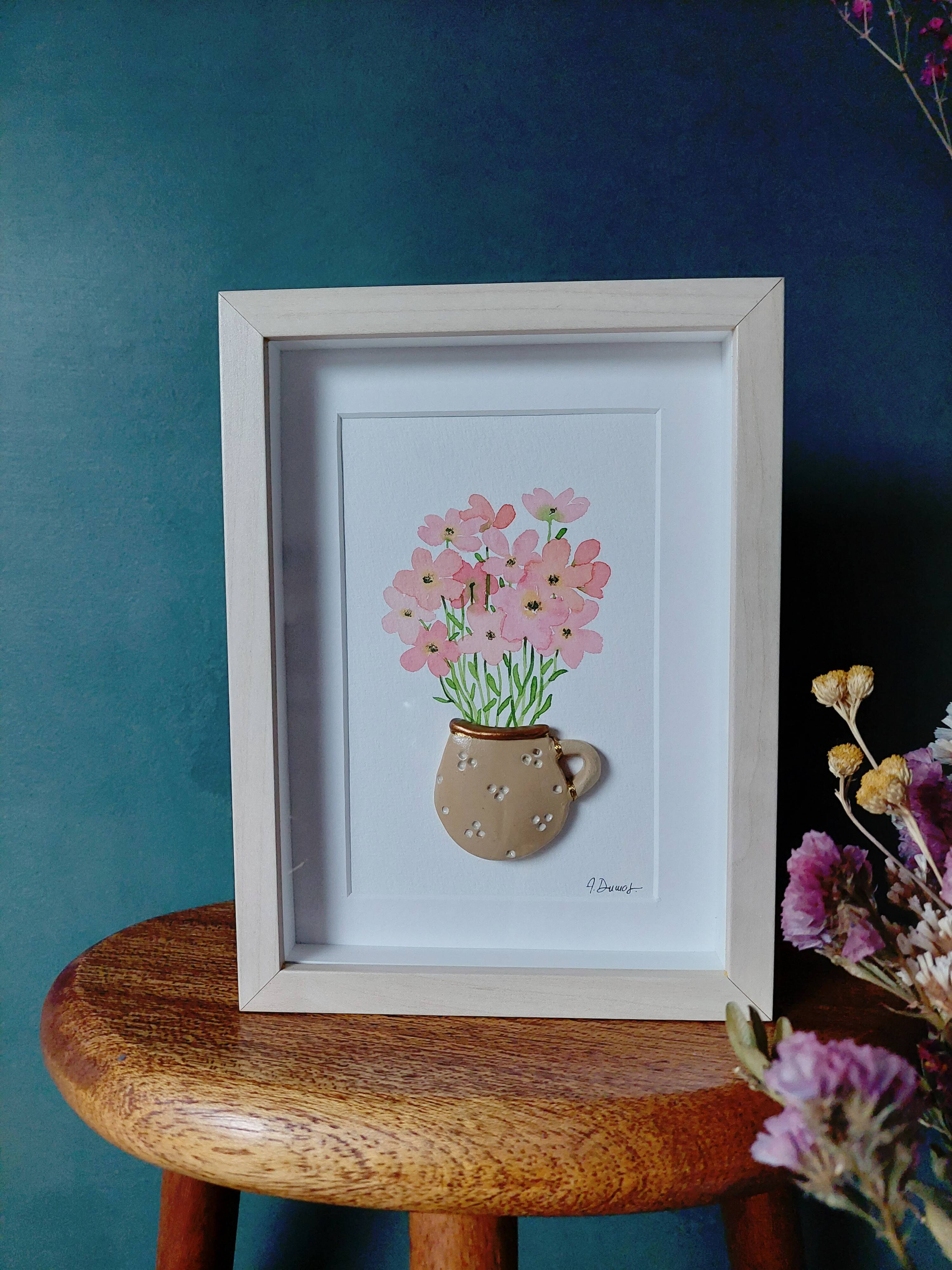 Relief painting bouquet of pink flowers in watercolor in a handmade clay mug