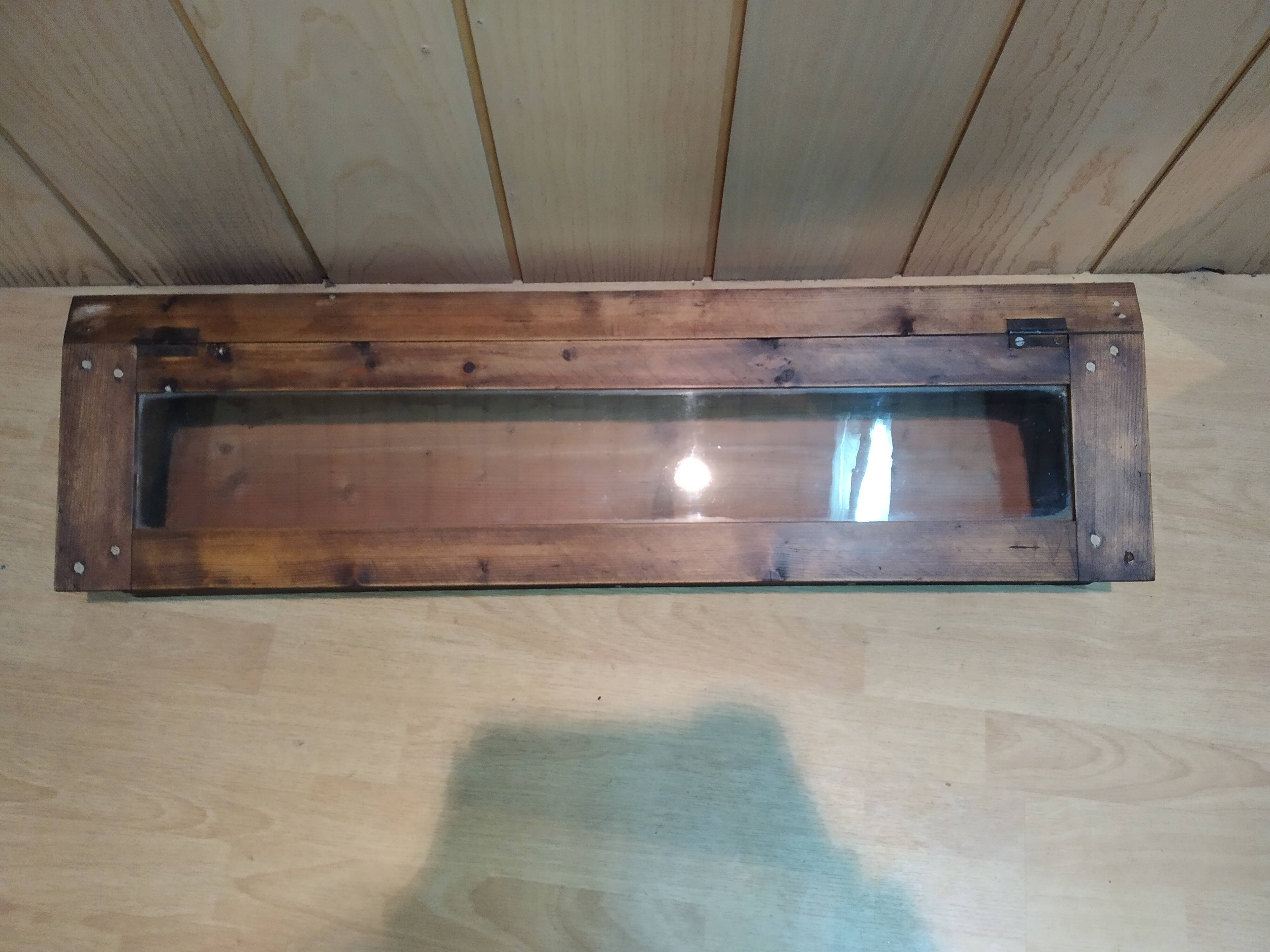 Former wooden display case