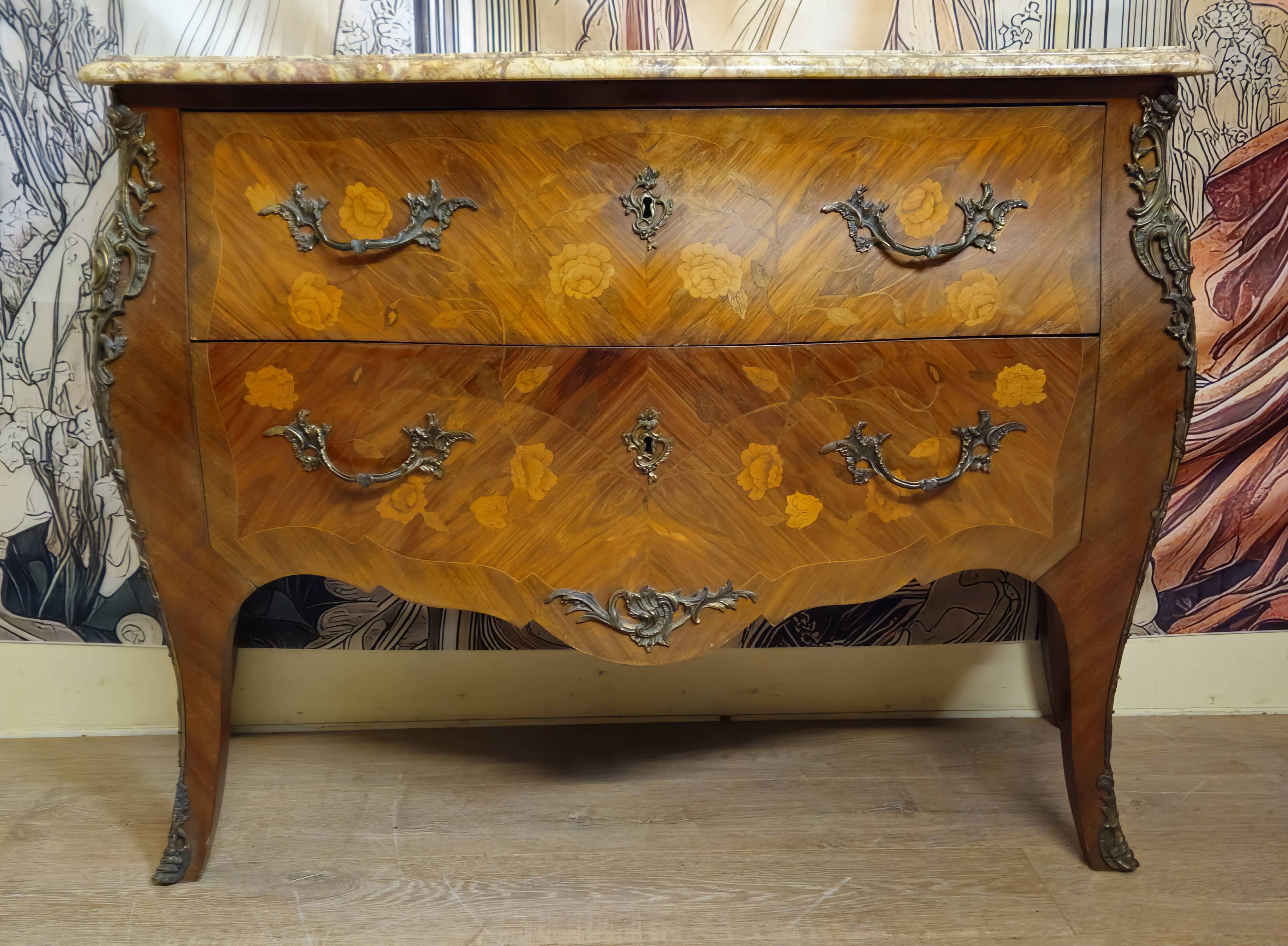 Curved Louis XV style commode with floral marquetry and marble top.