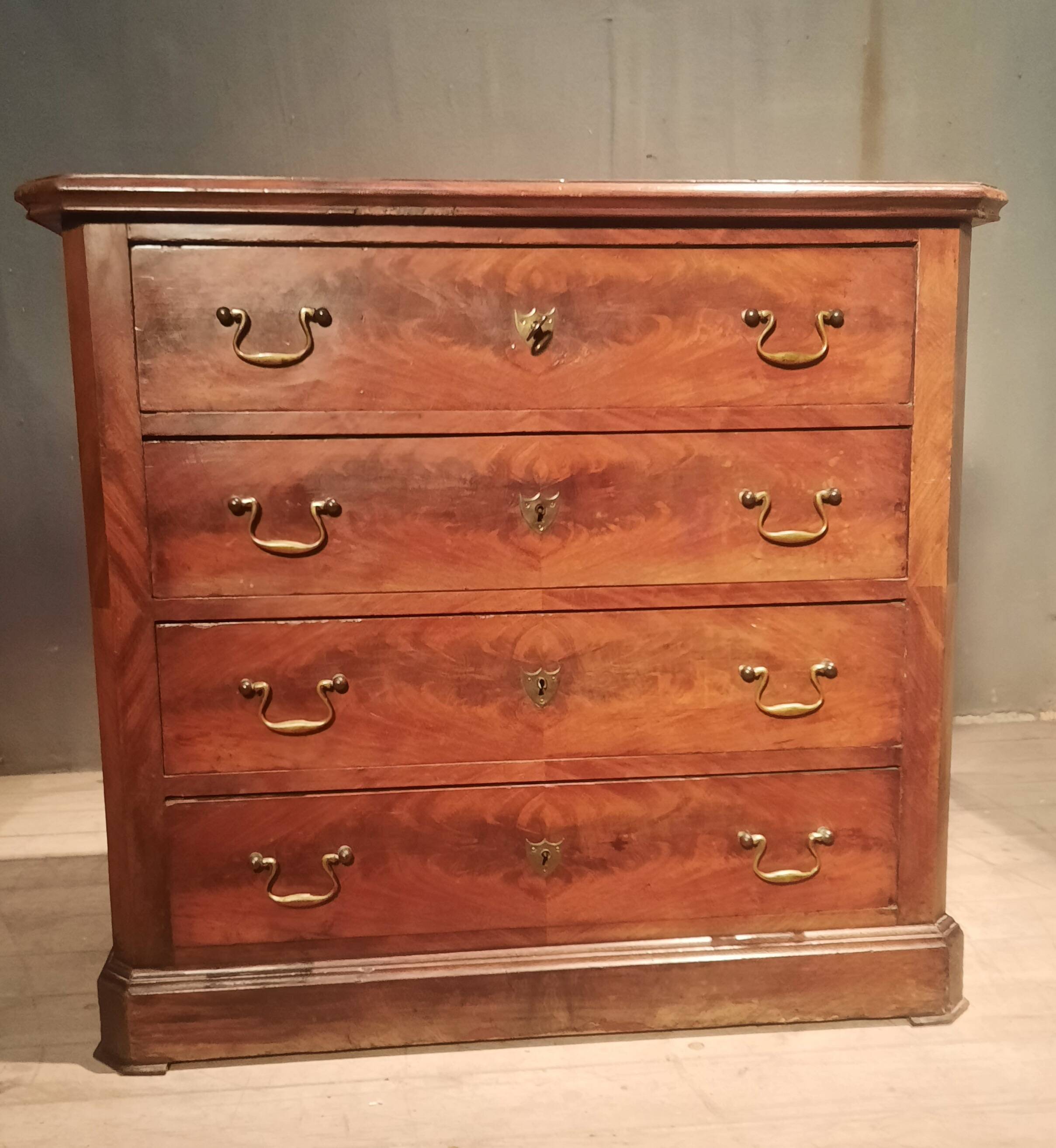 Small Louis Philippe chest of drawers with cut corners.