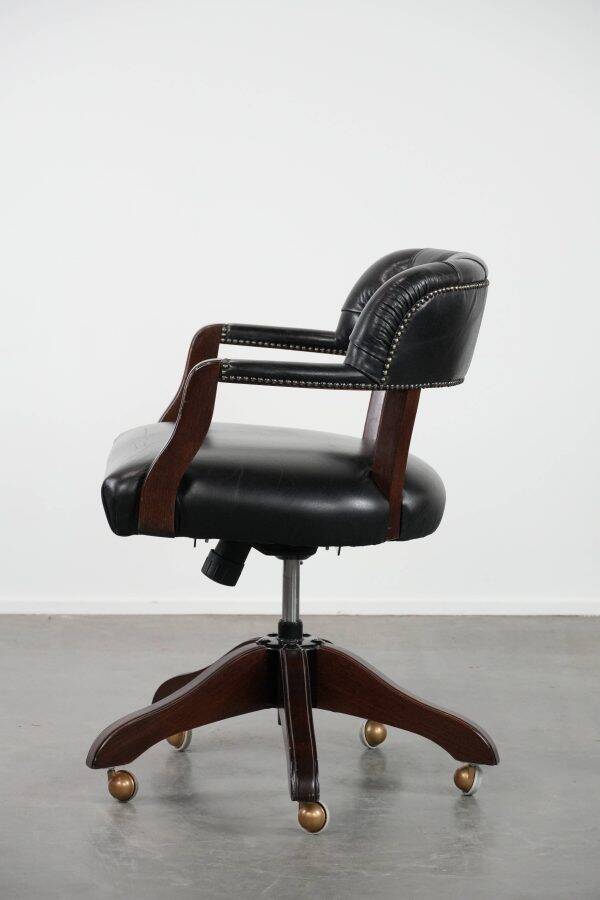 Adjustable black timeless Chesterfield office chair made of cow leather