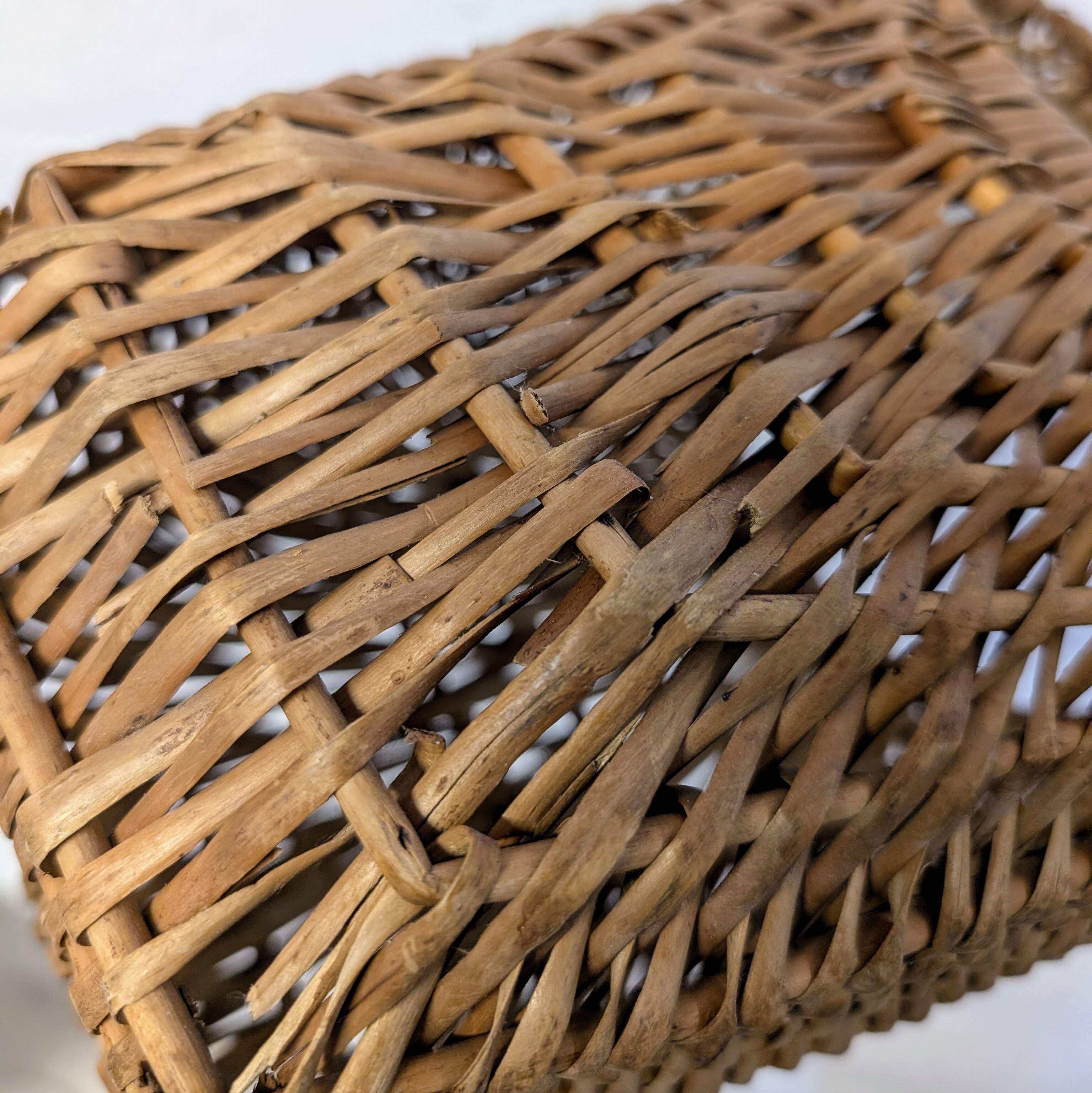 Large-handled woven wicker basket