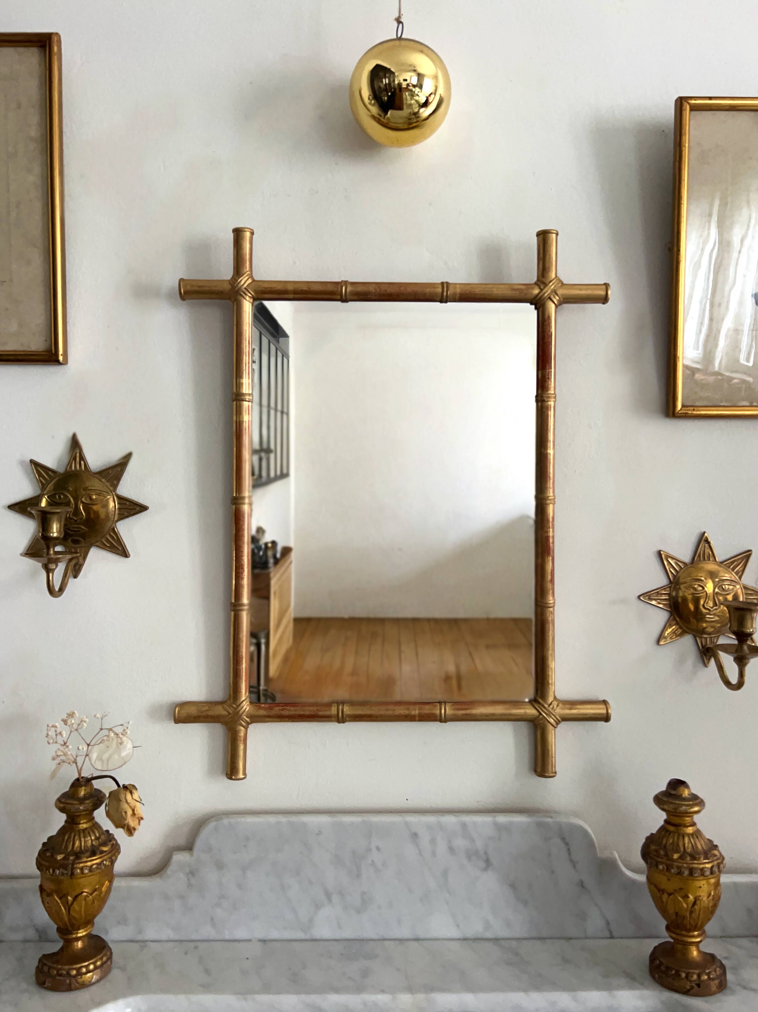 Mirror in gilded stucco, bamboo patina and gold leaf.