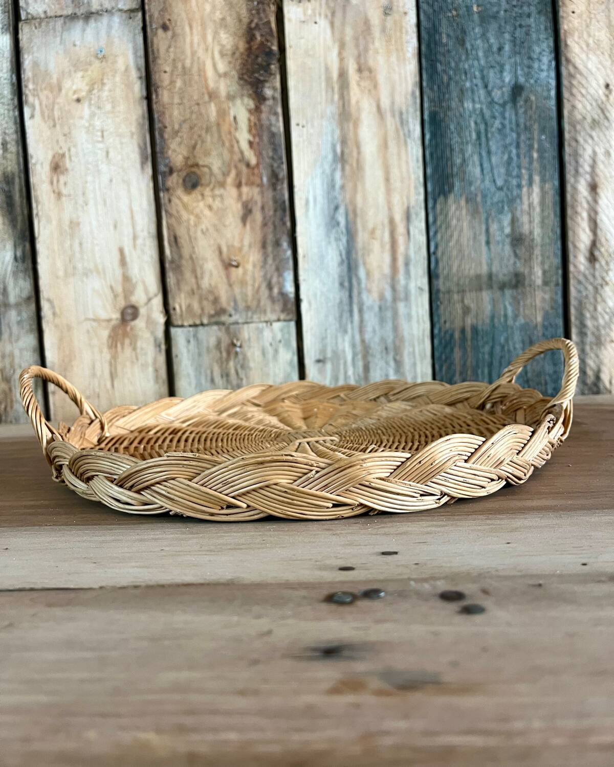 Antique flat round rattan basket