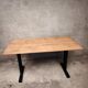 Unique wooden table with metal industrial legs.