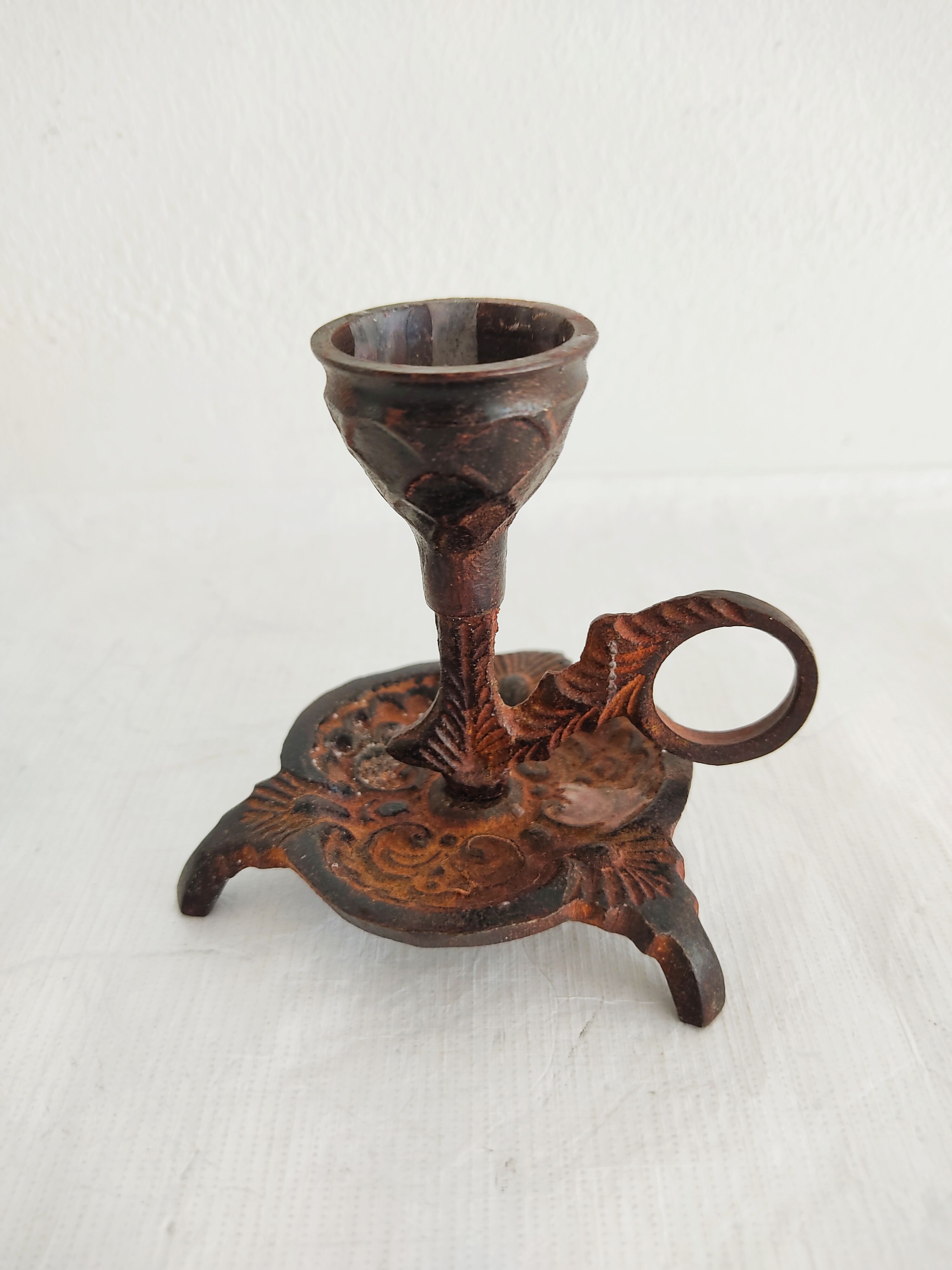 Pair of bronze hand-held candlesticks