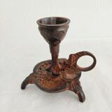 Pair of bronze hand-held candlesticks