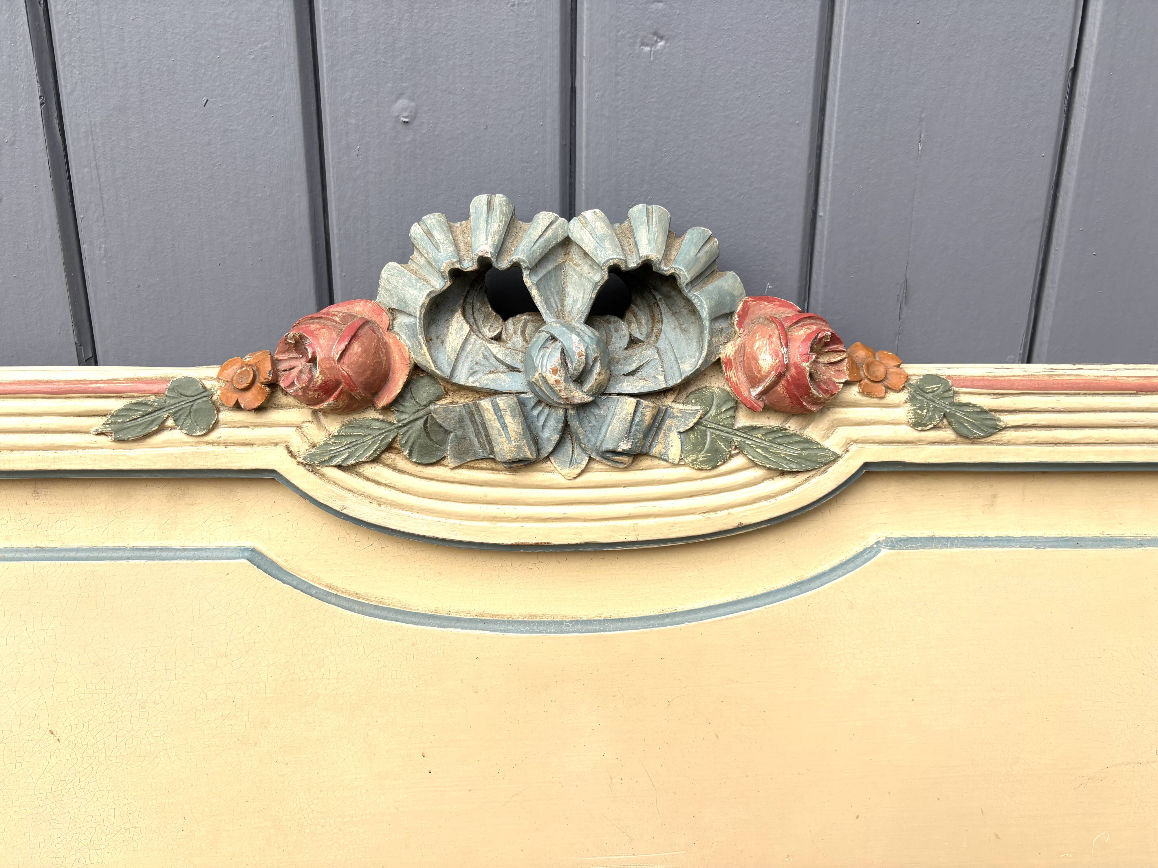 Carved and painted wooden bed