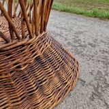 Old throne basket armchair in woven wicker