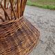 Old throne basket armchair in woven wicker