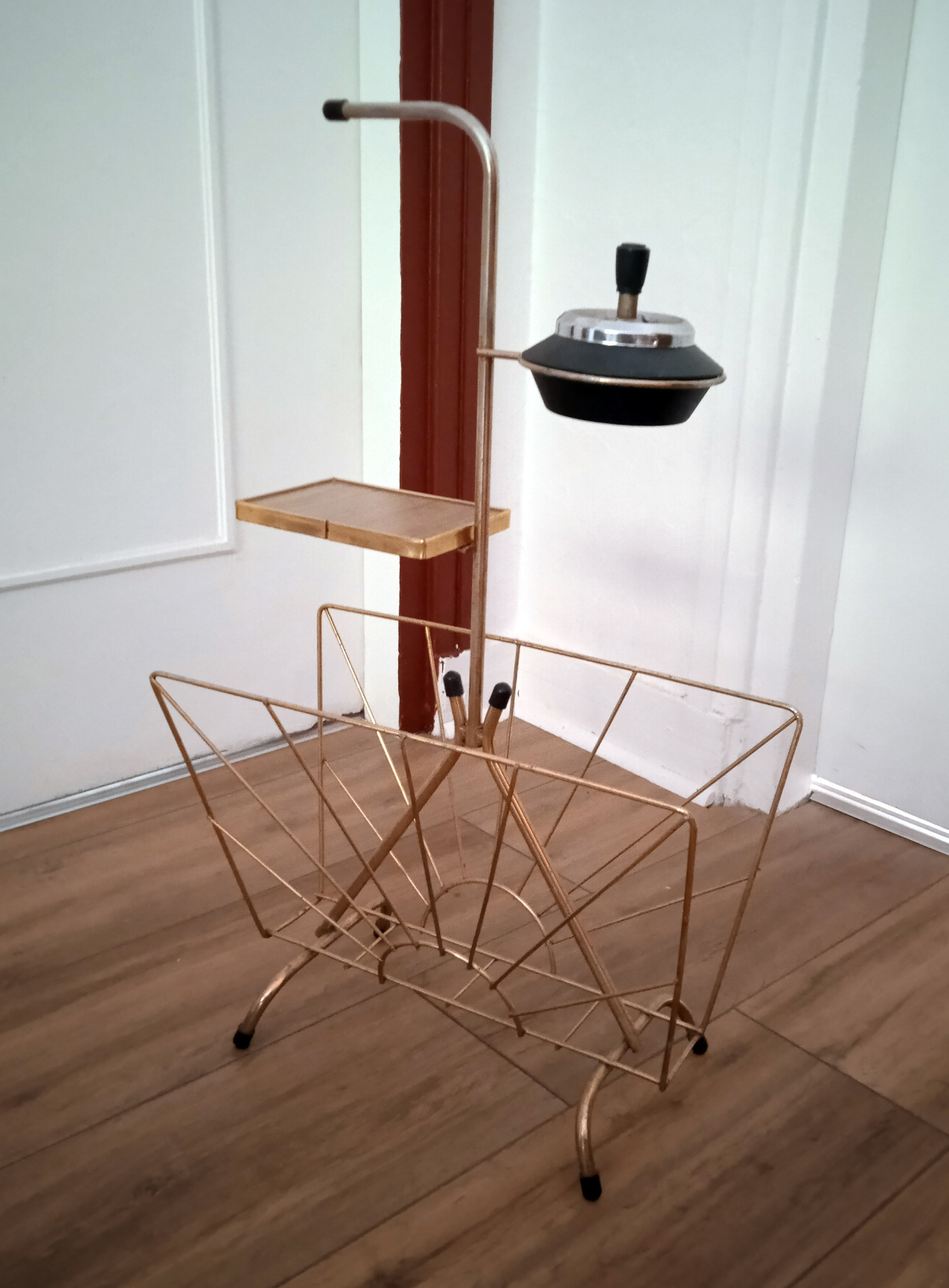 Modernist brass magazine holders