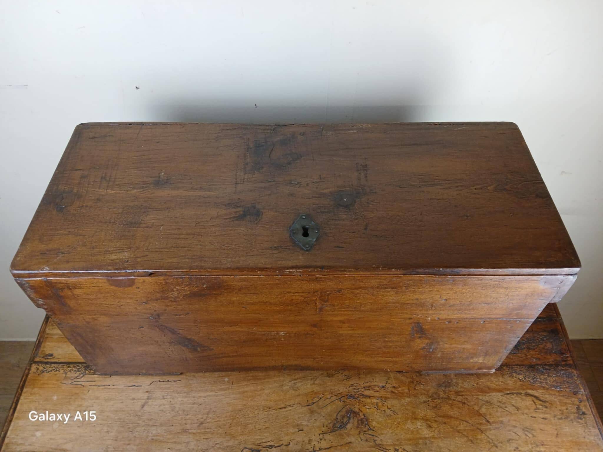 Old solid wood transport chest from the early 19th century