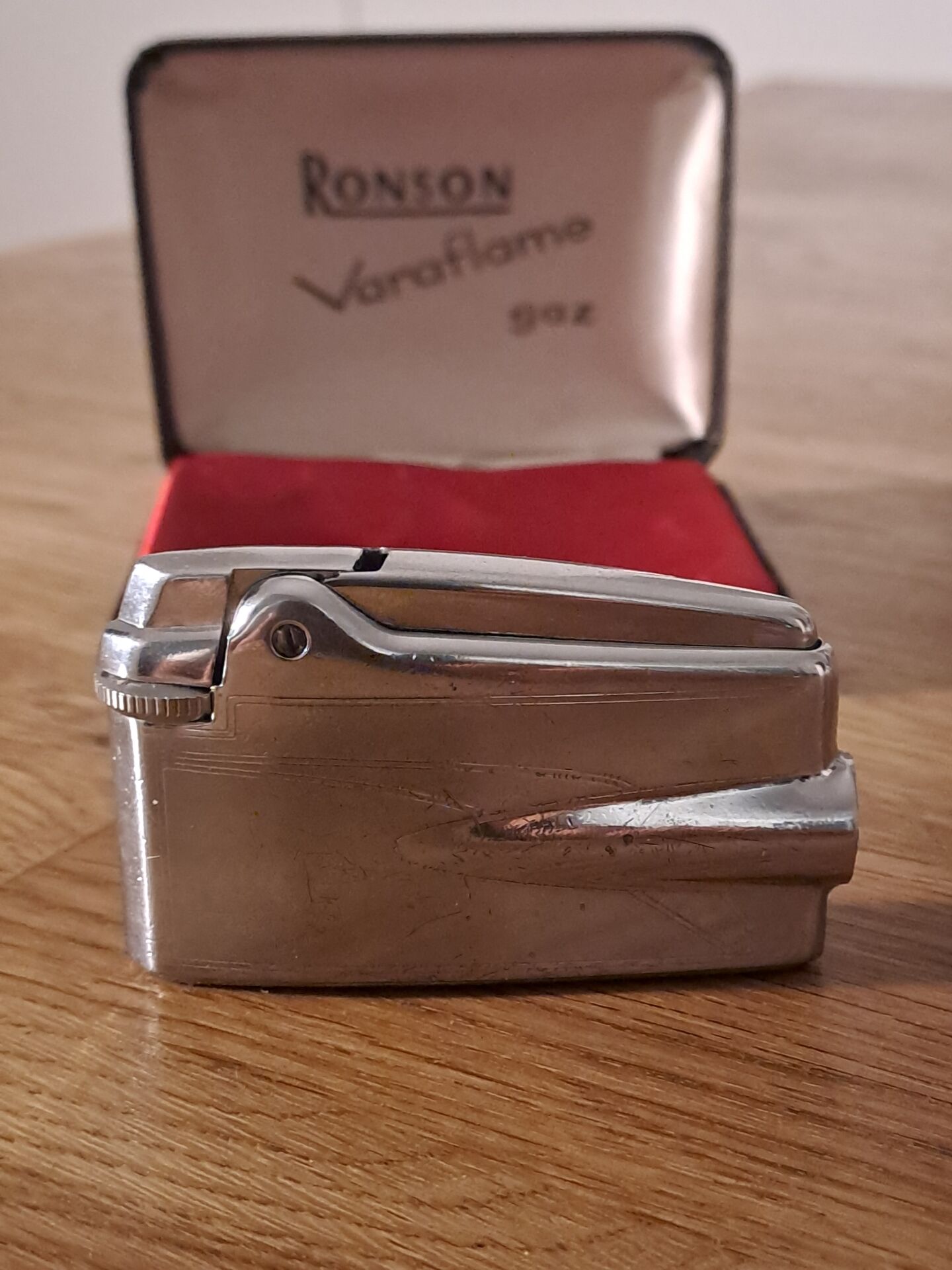 Vintage Ronson Varaflame chrome lighter and its original case.