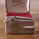 Vintage Ronson Varaflame chrome lighter and its original case.