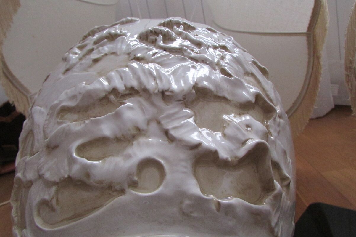 Pair of relief enameled porcelain lamps, Asian motif