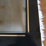 Black and gold coffee table with a double smoked glass top